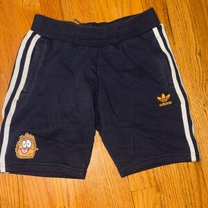 Adidas Dark Blue Shorts with White Stripes and Orange Logo